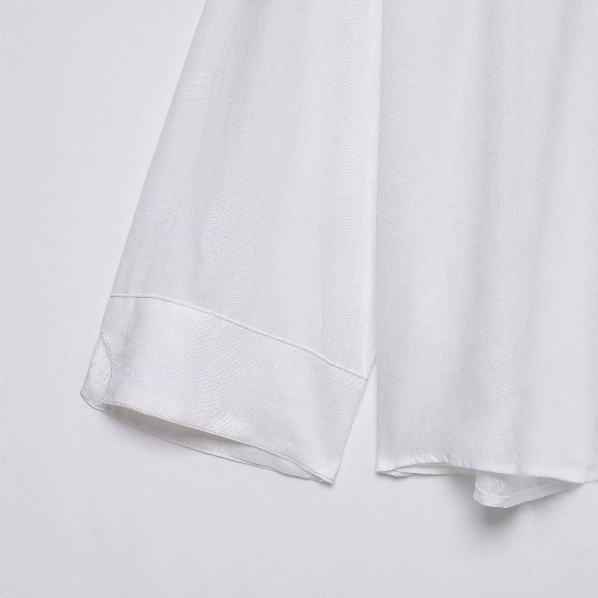 Single breasted deep V-neck linen long sleeved shirt for women