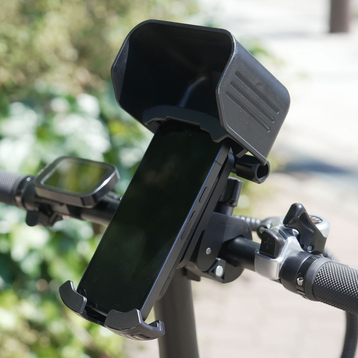 Sun visor handlebar phone holder for bicycles and motorcycles